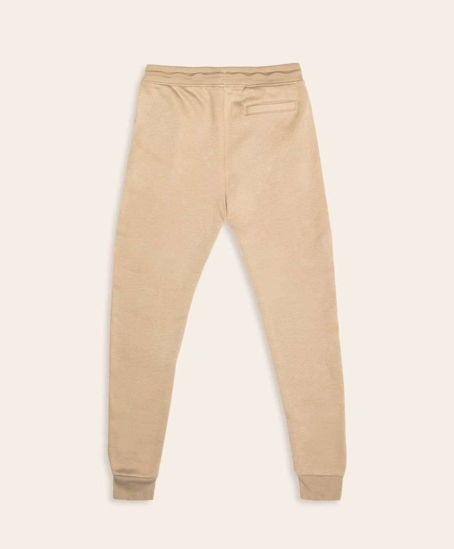 Ce jogging beige avec le logo Enfant du Racing est conçu pour ceux qui veulent allier confort et passion avec style